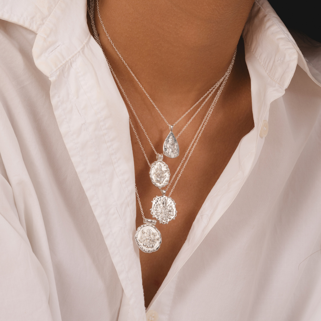 Elegant silver necklace with detailed Saraswati pendant by Rani and Co womens jewellery
