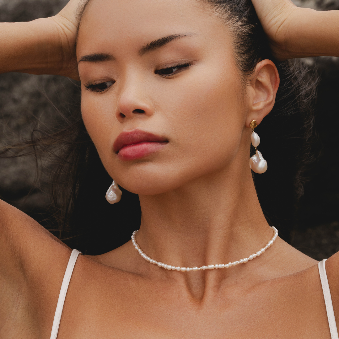 Freshwater pearl necklace styled with Aphrodite goddess jewellery by Rani and Co