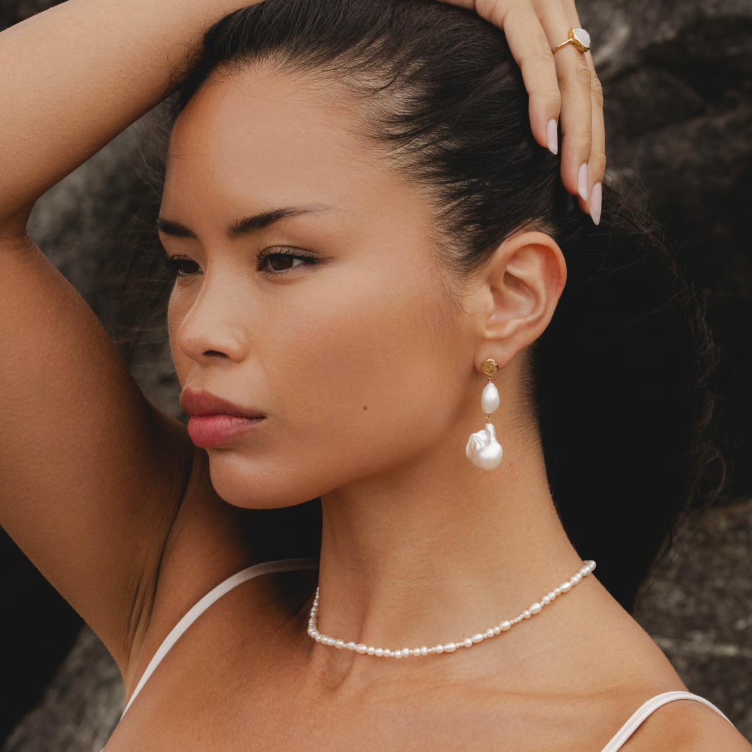 Freshwater pearl necklace styled with Aphrodite goddess jewellery by Rani and Co