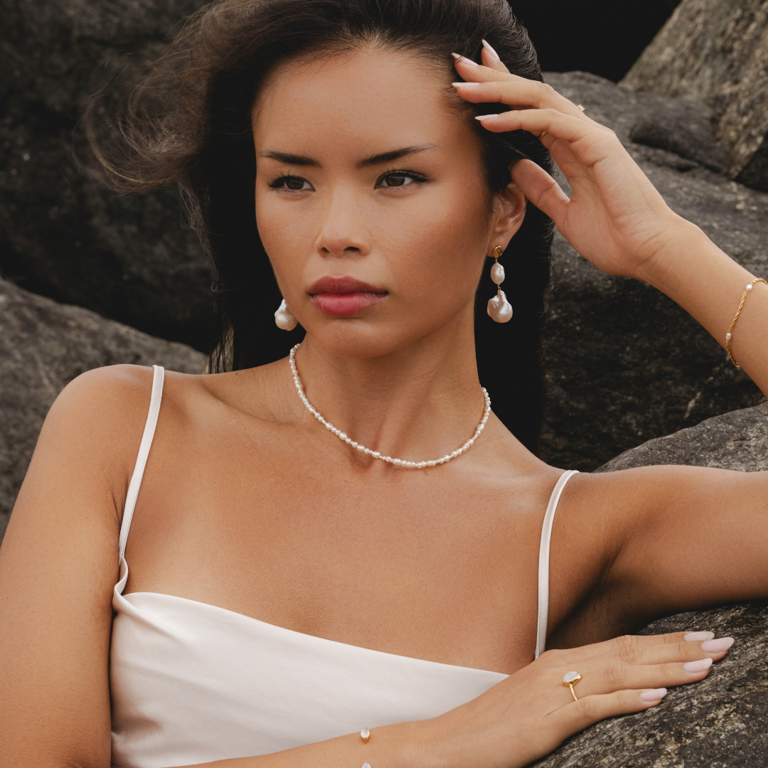 Freshwater pearl necklace styled with Aphrodite goddess jewellery by Rani and Co