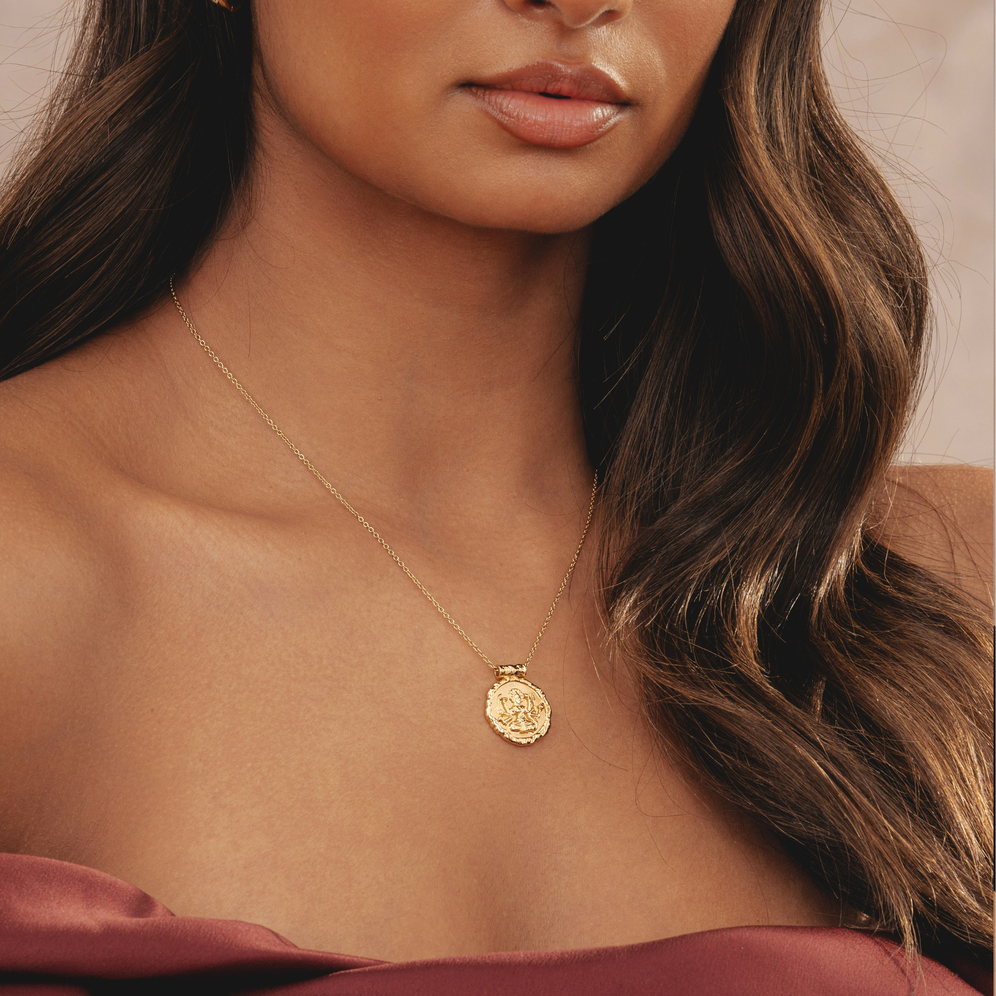 Sustainable Rani & Co. necklace featuring a hammered gold design, inspired by the Indian Hindu goddess Durga – empowering women with eco-friendly jewellery
