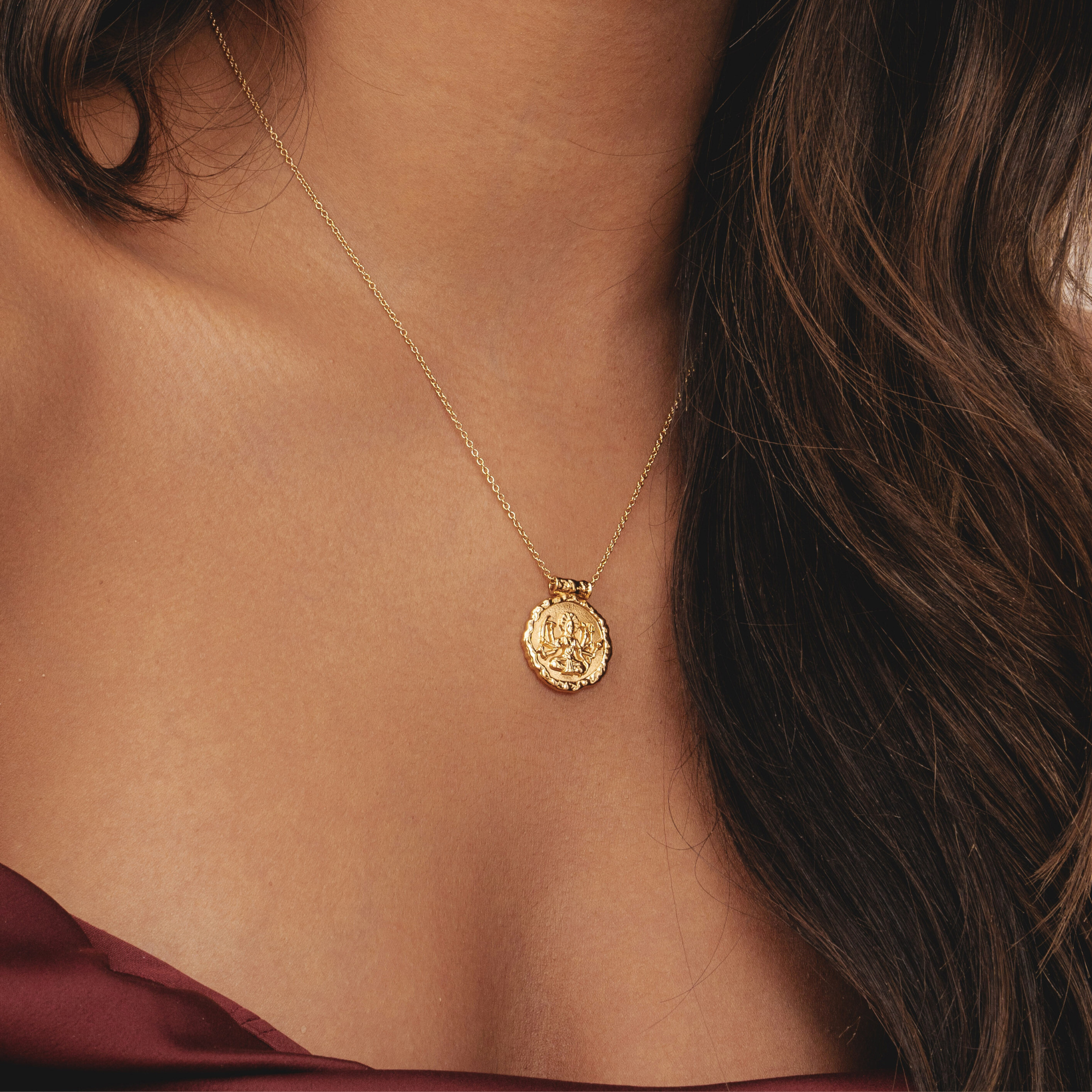 Explore the sustainable charm of Rani & Co.'s hammered gold necklace, influenced by the Indian Hindu goddess Durga – a symbol of empowerment for women