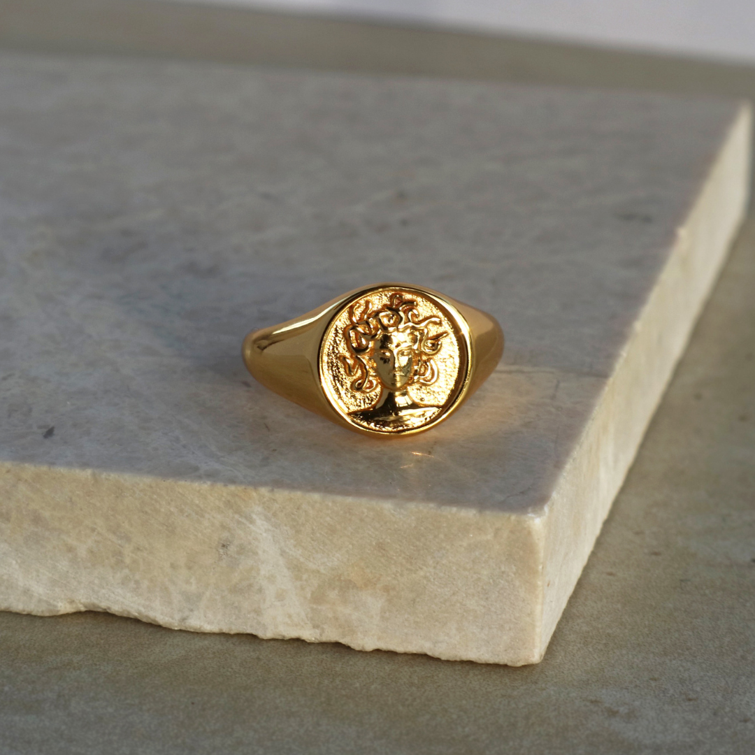 Gold signet ring for women featuring Medusa design in 18k plated finish by Rani and Co womens jewellery
