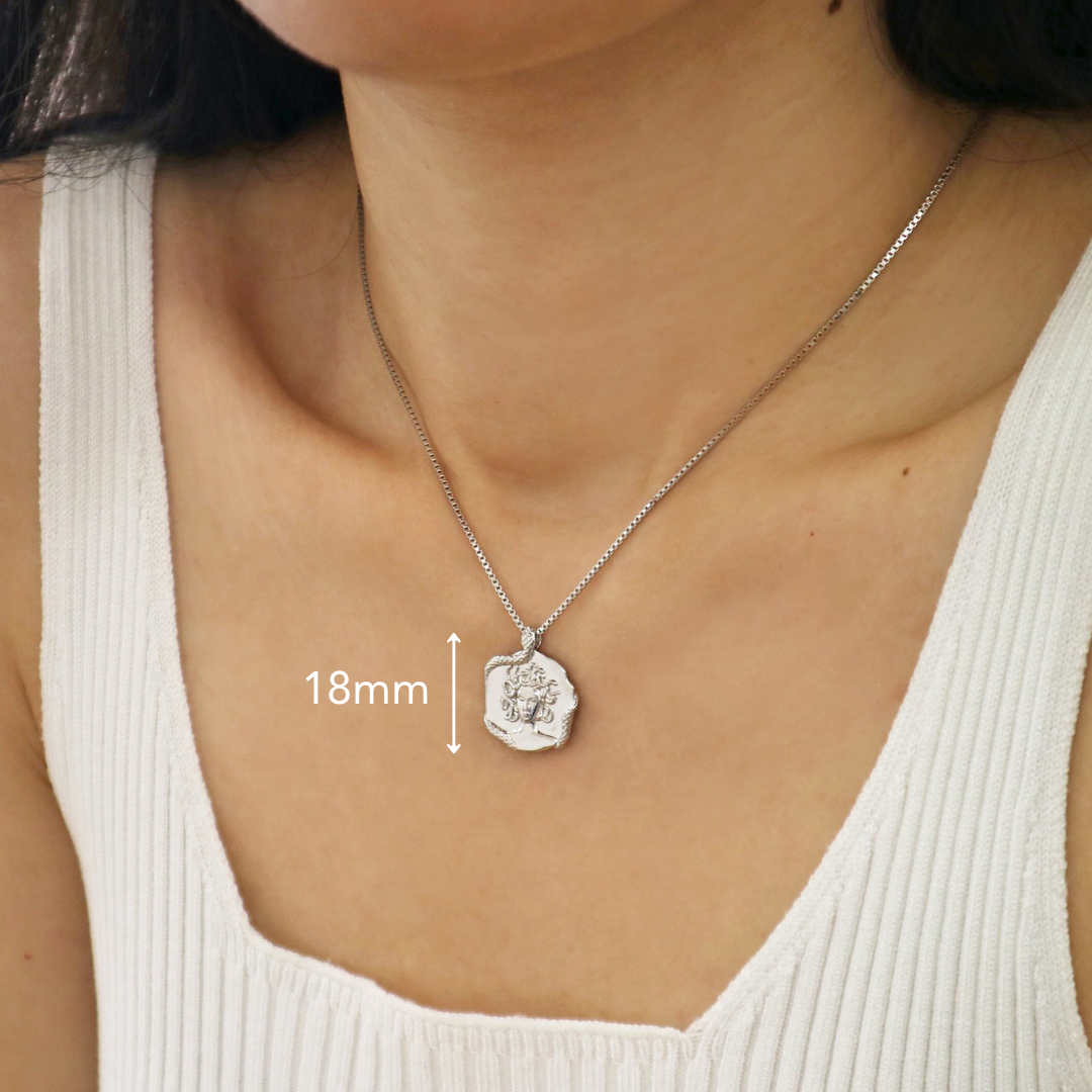 Silver necklace featuring a Medusa pendant a bold piece of Greek jewellery by Rani and Co