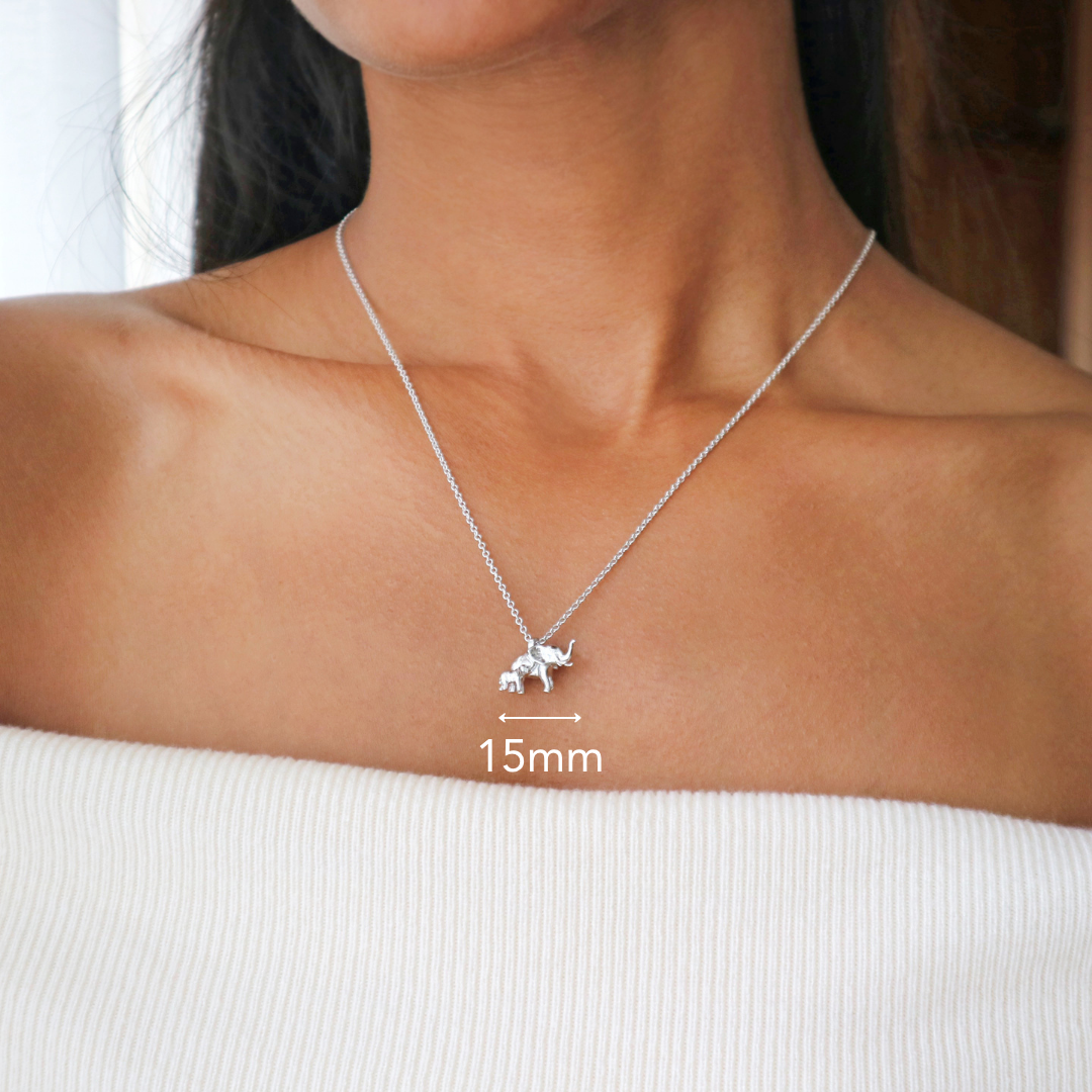 Womens jewellery by Rani and Co with a delicate silver necklace showing elephant and baby