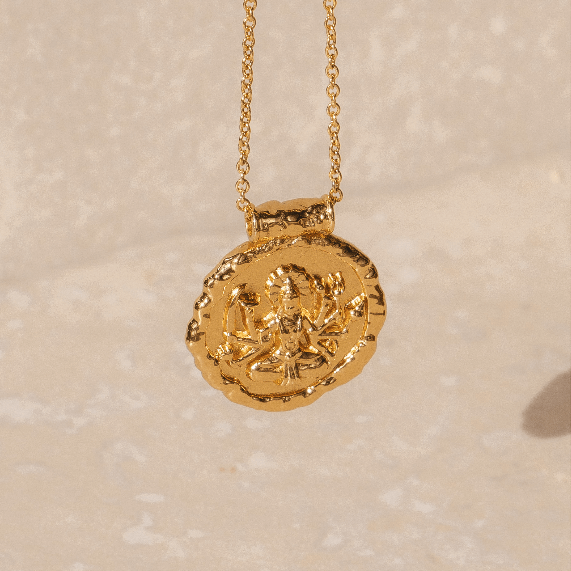 Gold pendant necklace featuring Hindu goddess Durga in 18k plated finish by Rani and Co womens jewellery