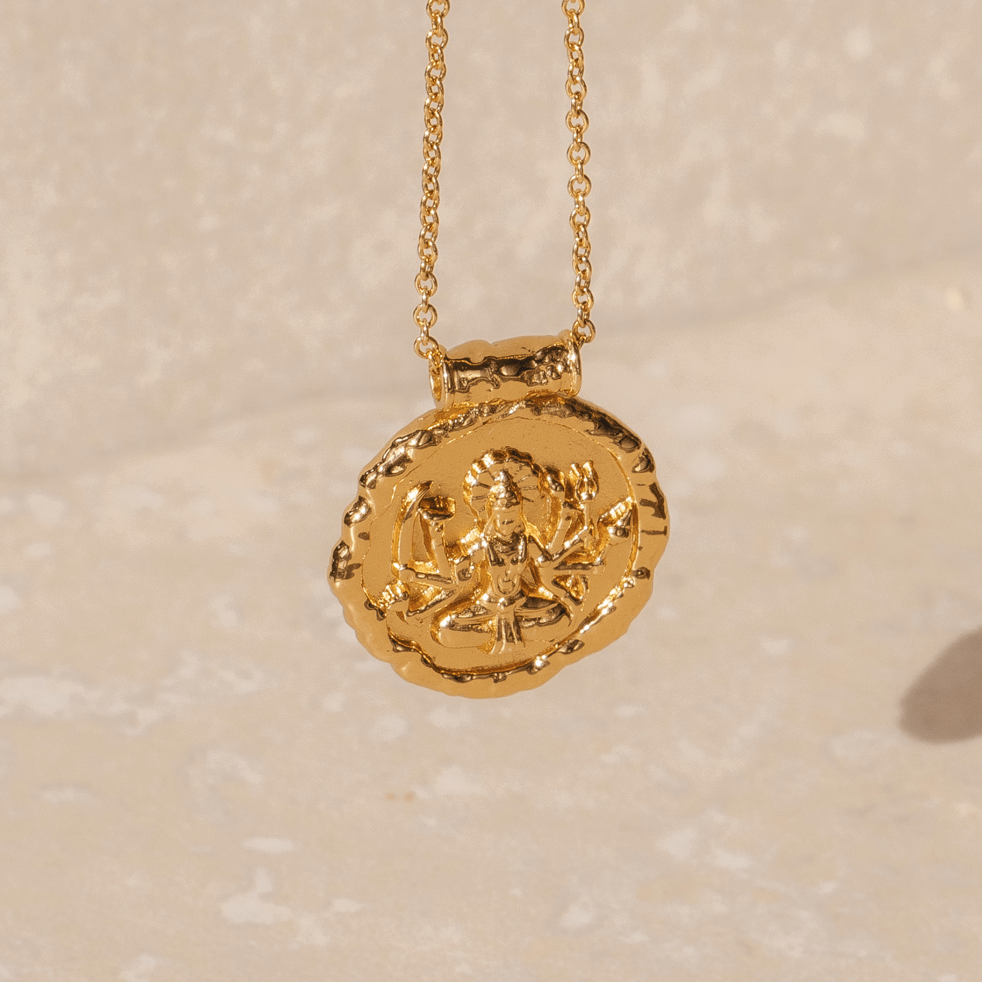 Gold pendant necklace featuring Hindu goddess Durga in 18k plated finish by Rani and Co womens jewellery