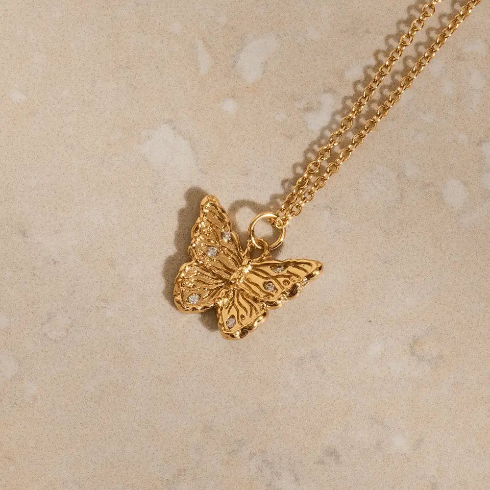 Minimalist gold butterfly pendant necklace, cubic zirconia wing detail, nickel-free ethical jewellery