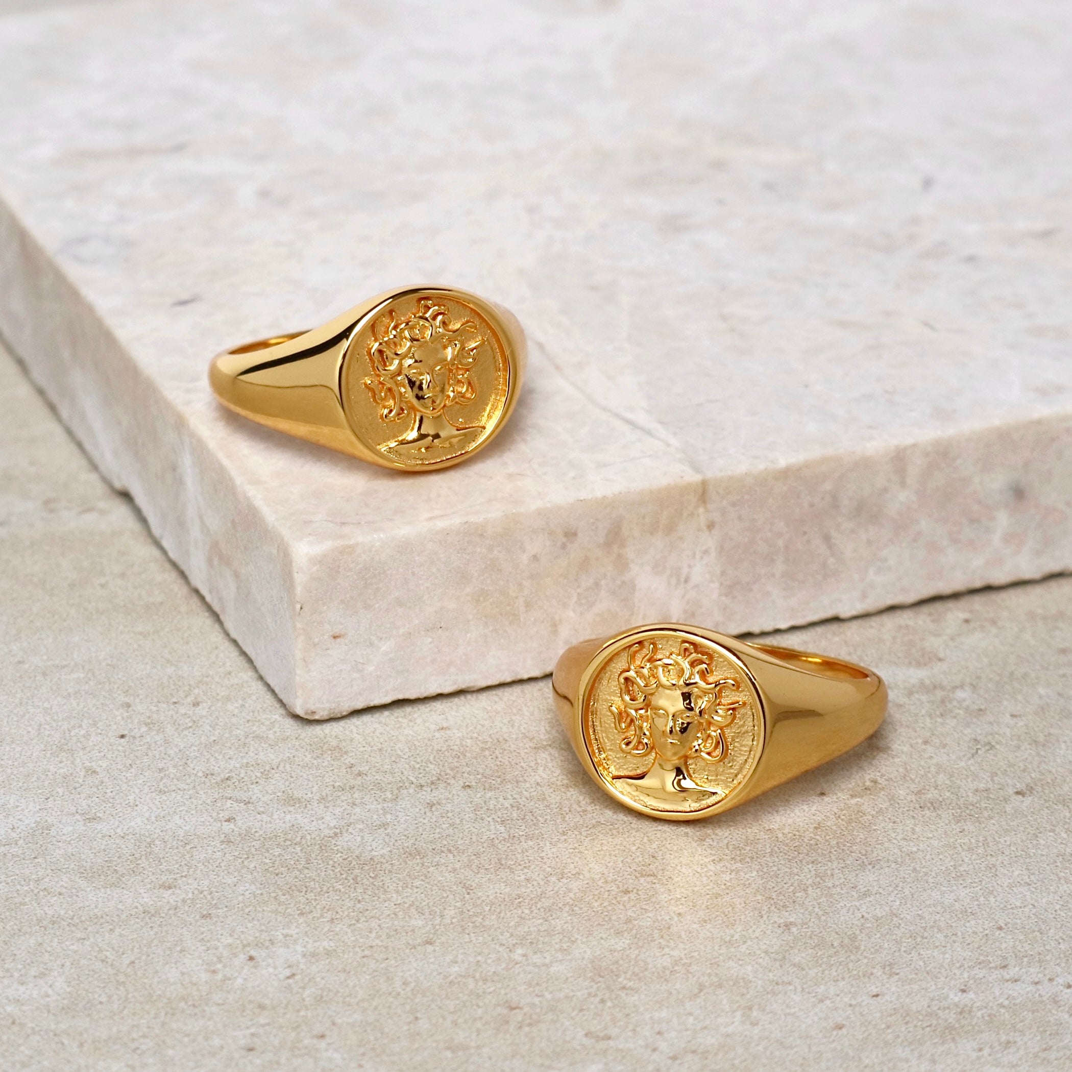 Gold signet ring for women featuring Medusa design in 18k plated finish by Rani and Co womens jewellery