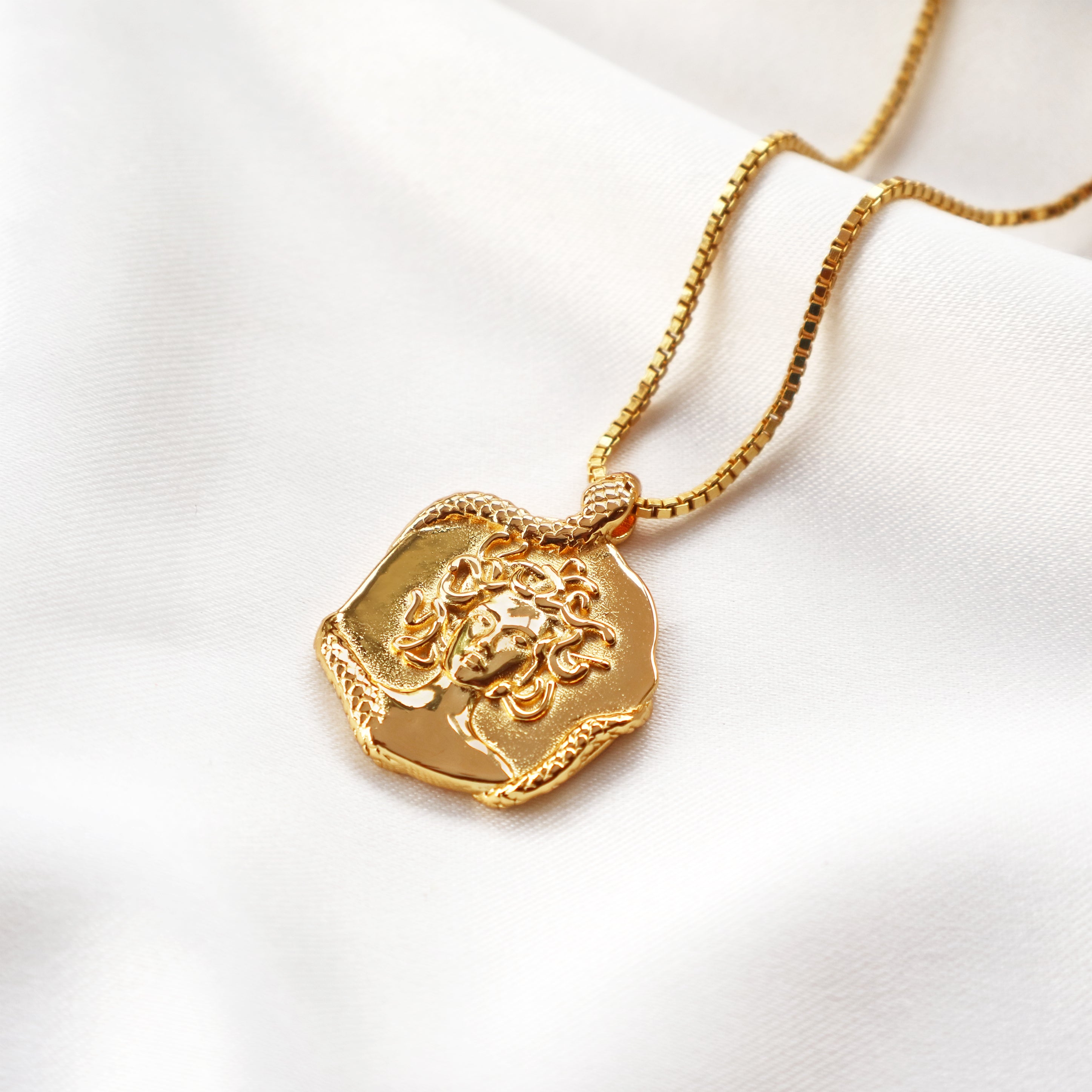 Medusa necklace featuring a gold pendant design inspired by the Greek goddess crafted for women by Rani and Co