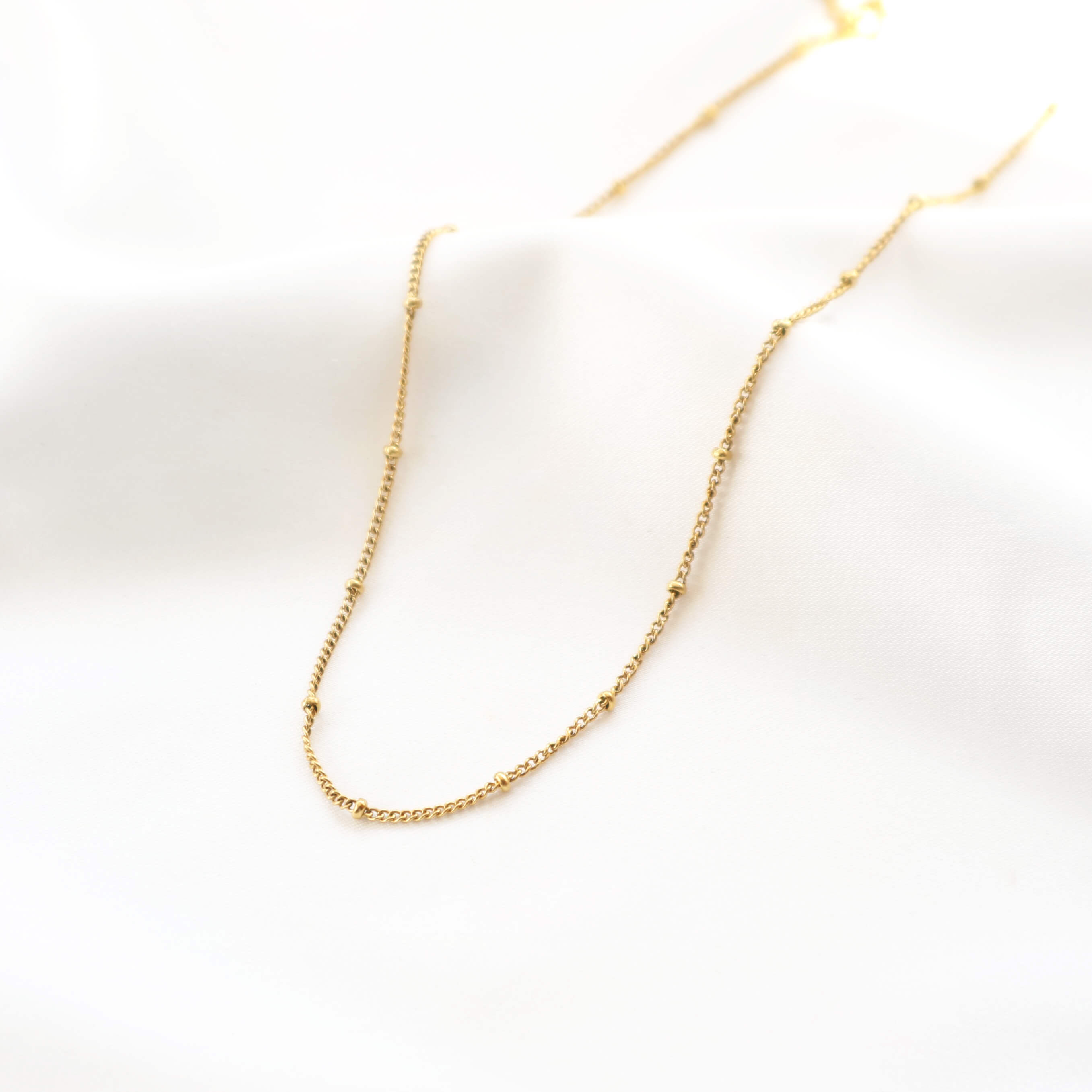 Gold satellite necklace made with 18k gold plated chain waterproof and perfect for everyday womens jewellery by Rani and Co