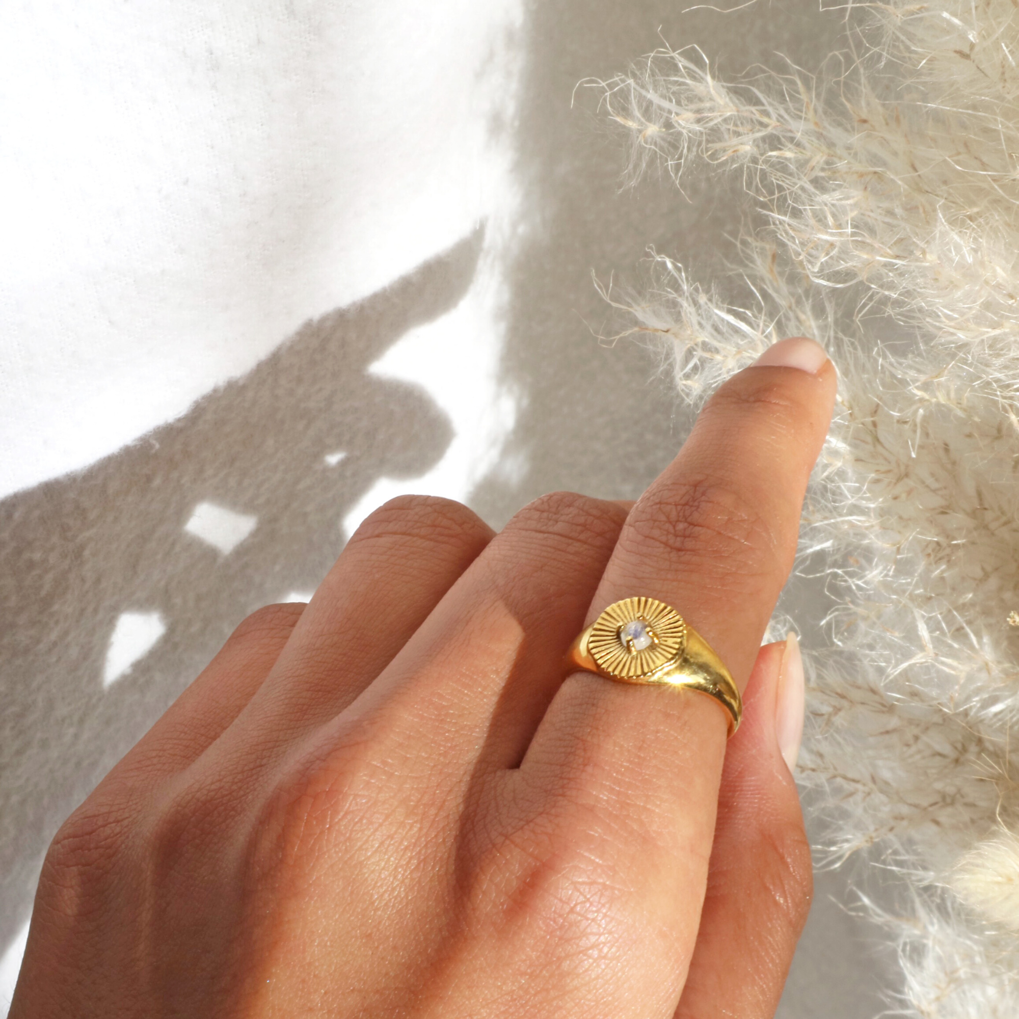 Gold jewellery by Rani and Co – rings for women featuring natural moonstone and radiant sun ray details