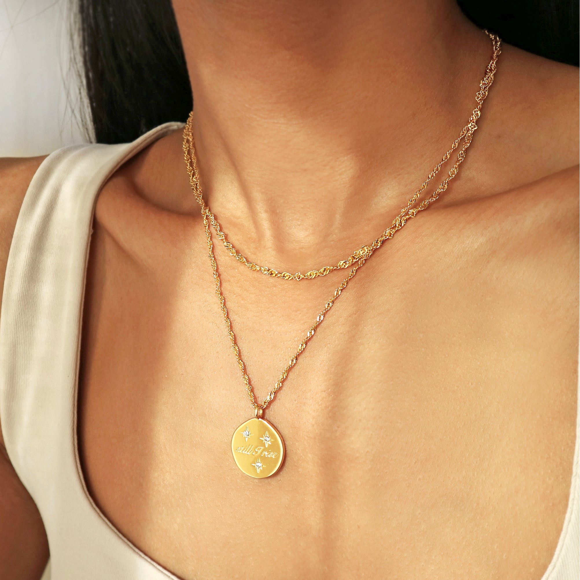 Elegant waterproof gold necklace featuring a delicate twist chain by Rani and Co