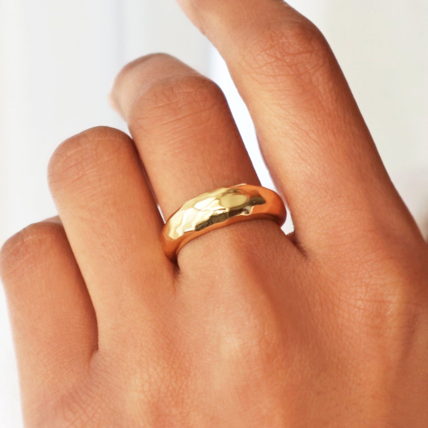 Gold ring with a sculptural hammered design crafted in gold vermeil by Rani and Co womens jewellery