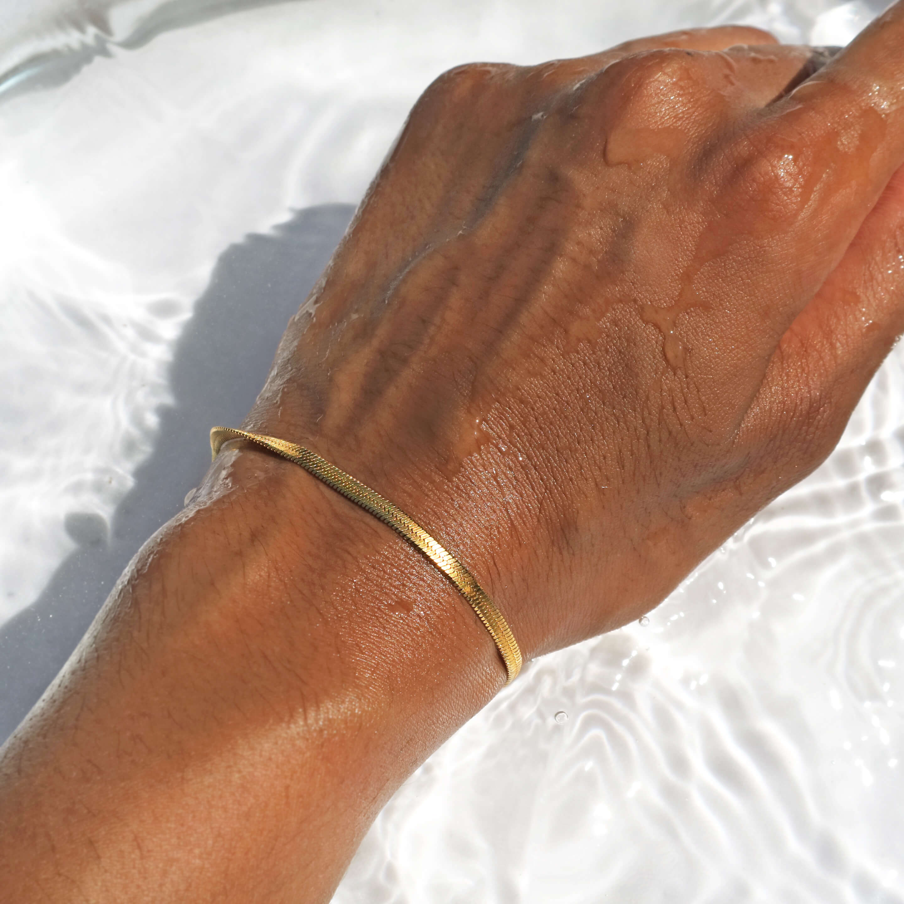Gold snake chain bracelet 18k gold plated waterproof and water resistant minimal design by Rani and Co womens jewellery