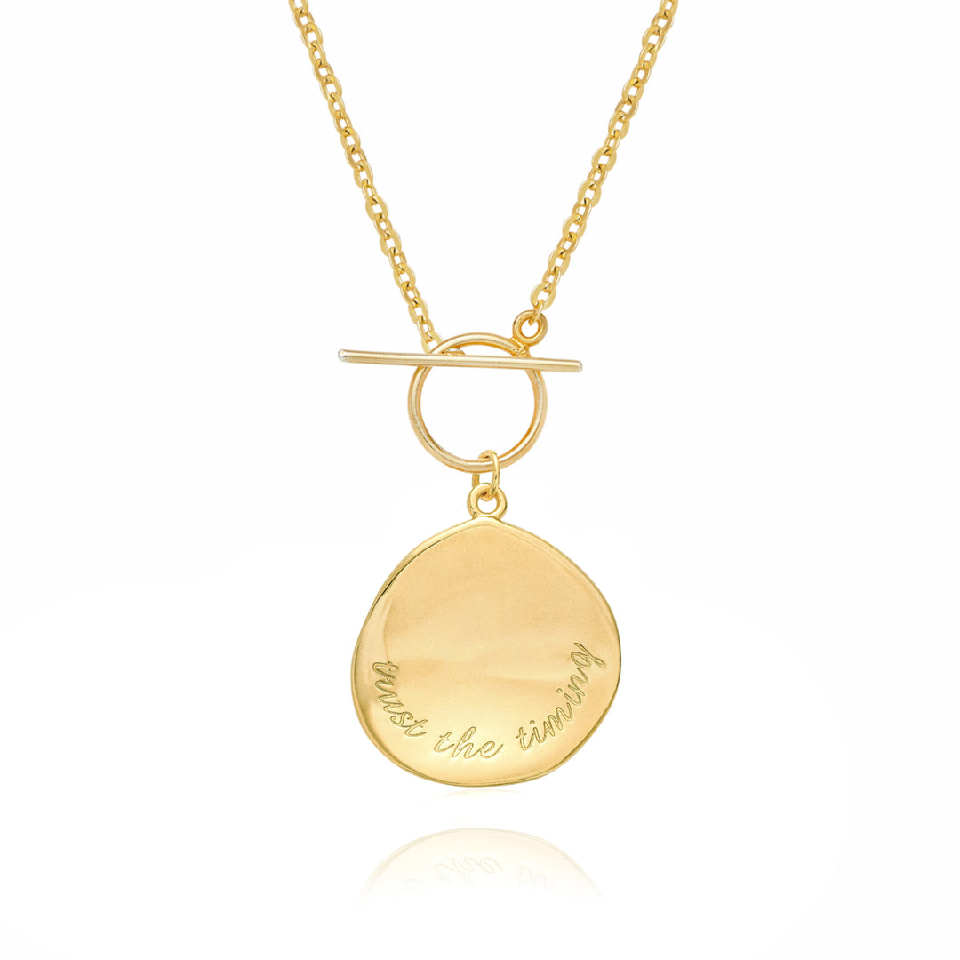 Gold pendant necklace engraved with Trust the timing a meaningful jewellery piece by Rani and Co for women