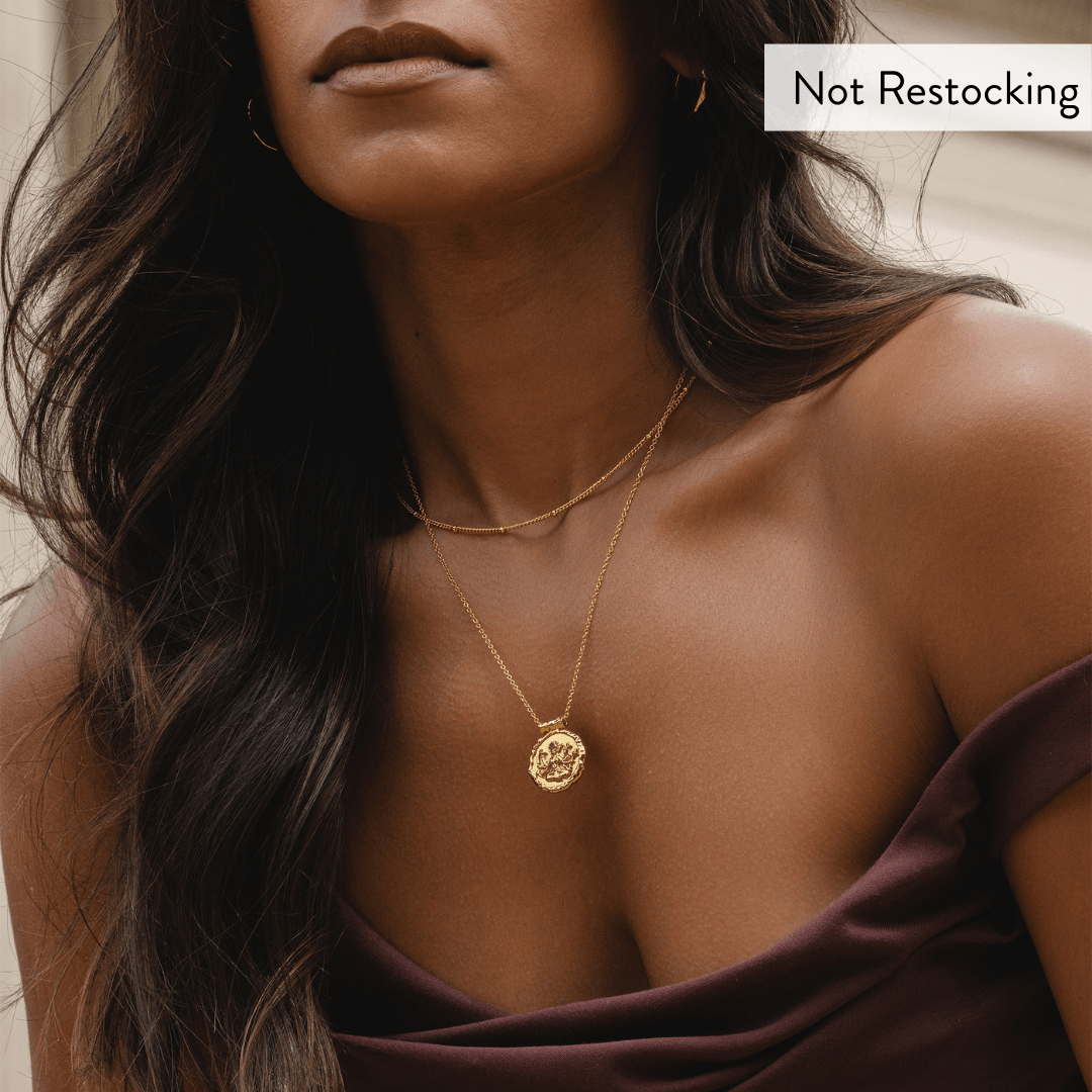 Limited Edition Goddess Durga Amethyst Necklace close-up worn on gold chain with natural amethyst pendant.
