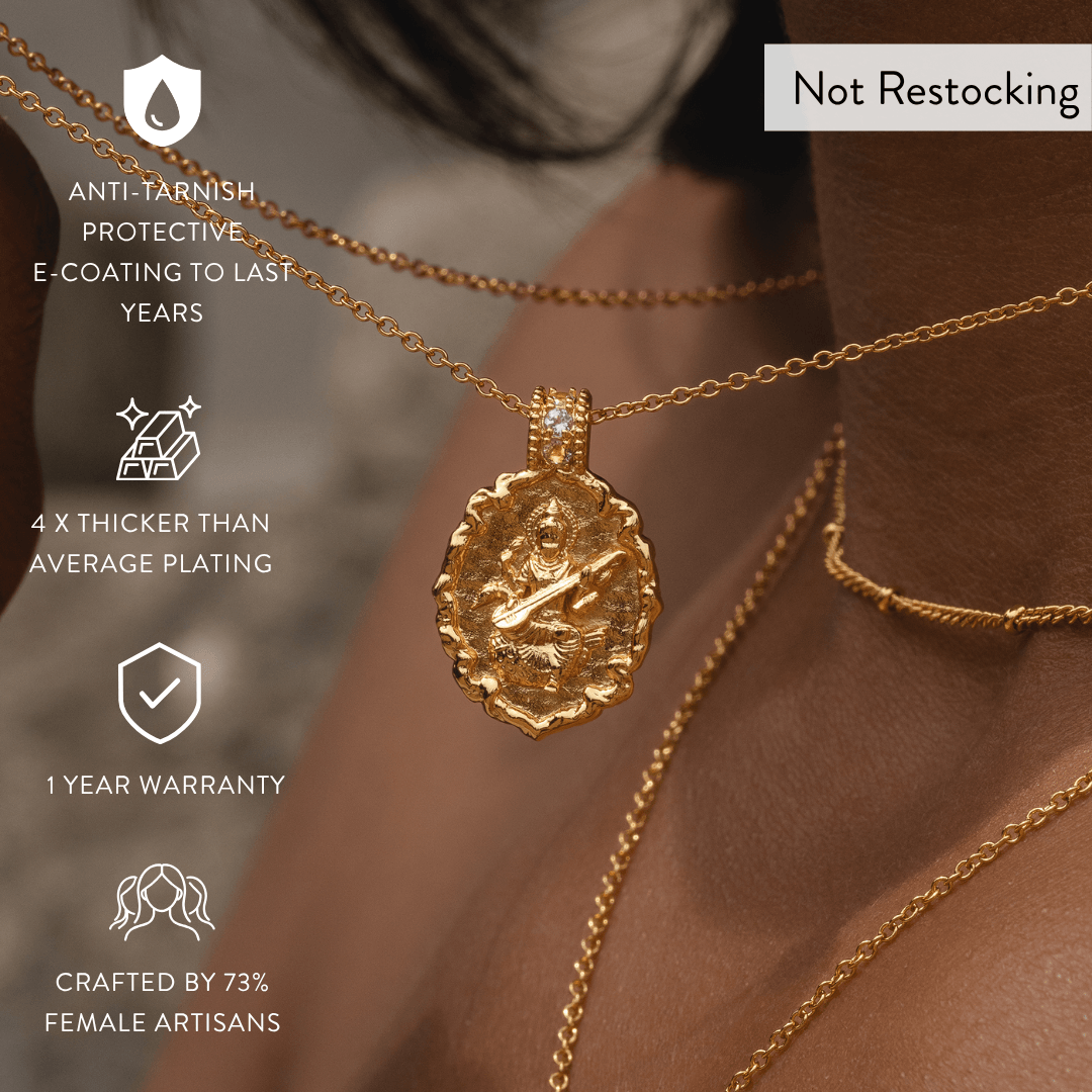 Limited Edition Goddess Saraswati Blue Topaz Necklace showing anti-tarnish finish, thick gold plating and one-year warranty.