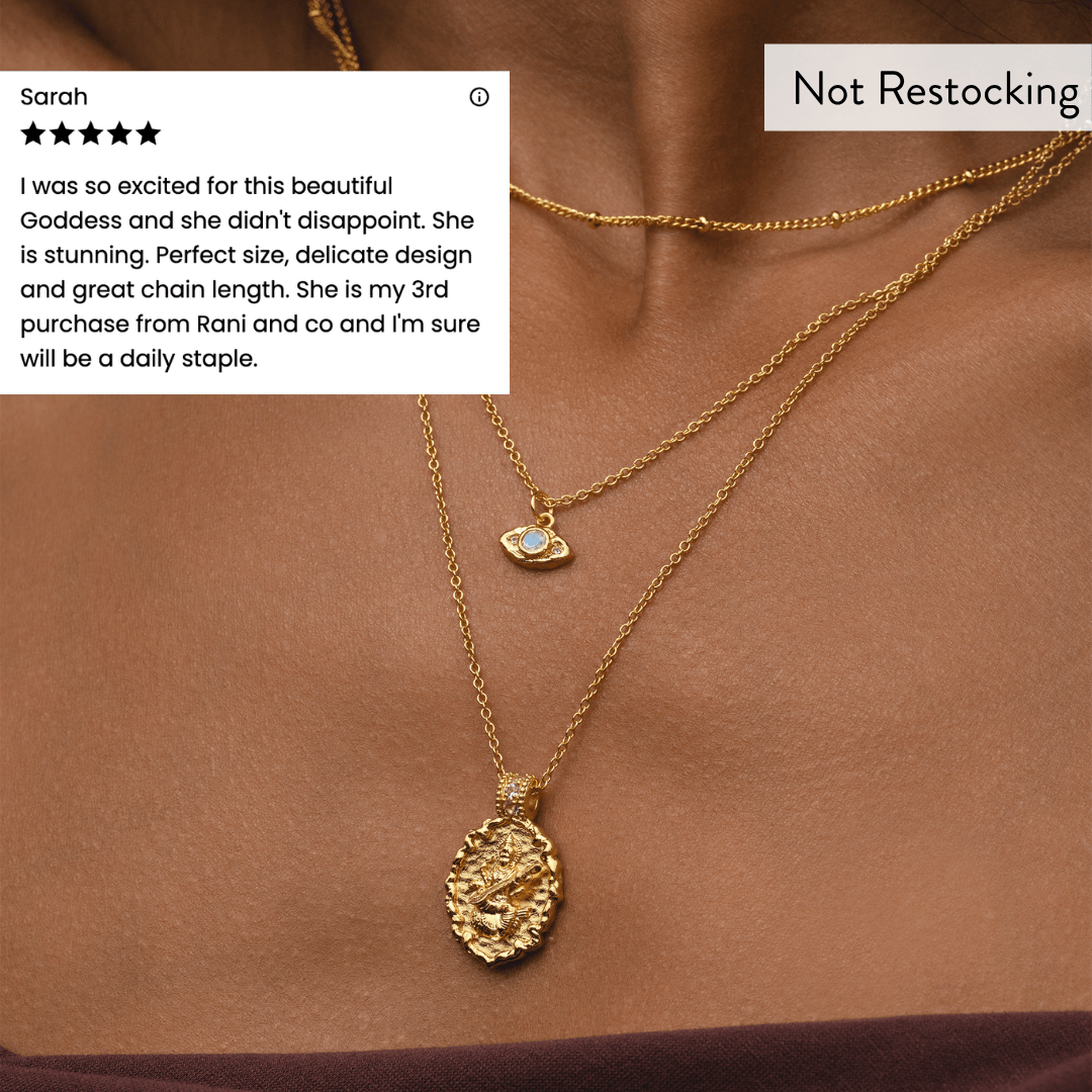 Limited Edition Goddess Saraswati Blue Topaz Necklace worn layered with customer review and meaningful gold jewellery.
