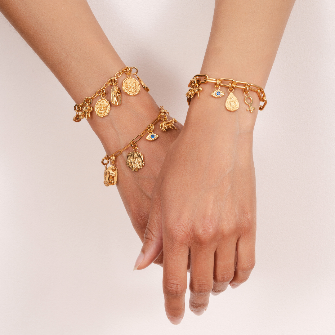 Elegant gold female symbol charm for charm bracelets by Rani and Co.