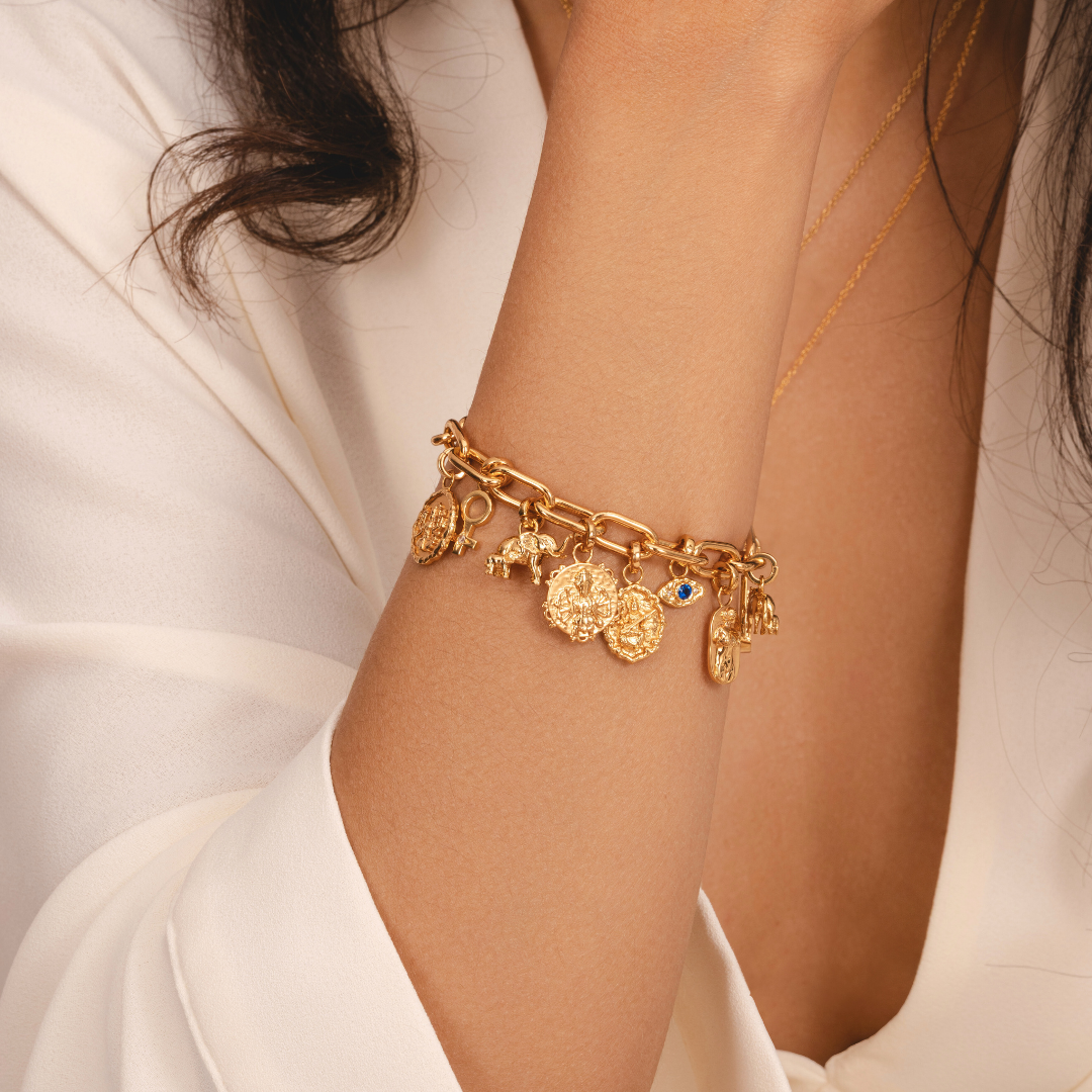 Elegant gold female symbol charm for charm bracelets by Rani and Co.