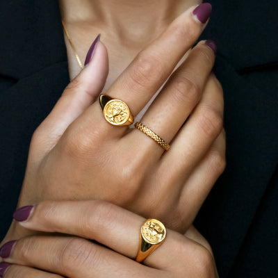 "Gold Medusa Signet Ring - Elegant women's accessory with intricate Medusa design."