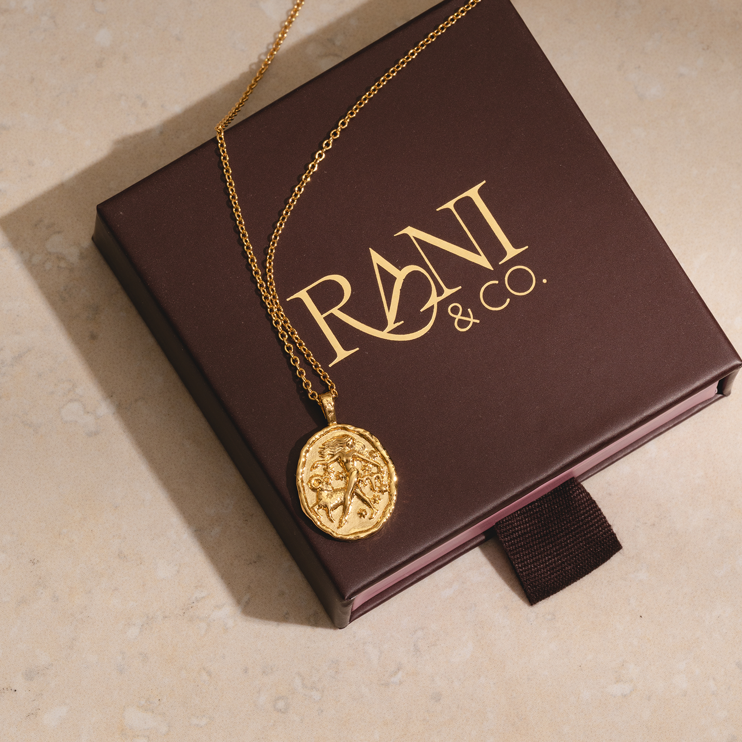 Rani & Co. gold Aries zodiac coin necklace 18k plated, woman and ram star sign jewellery gift
