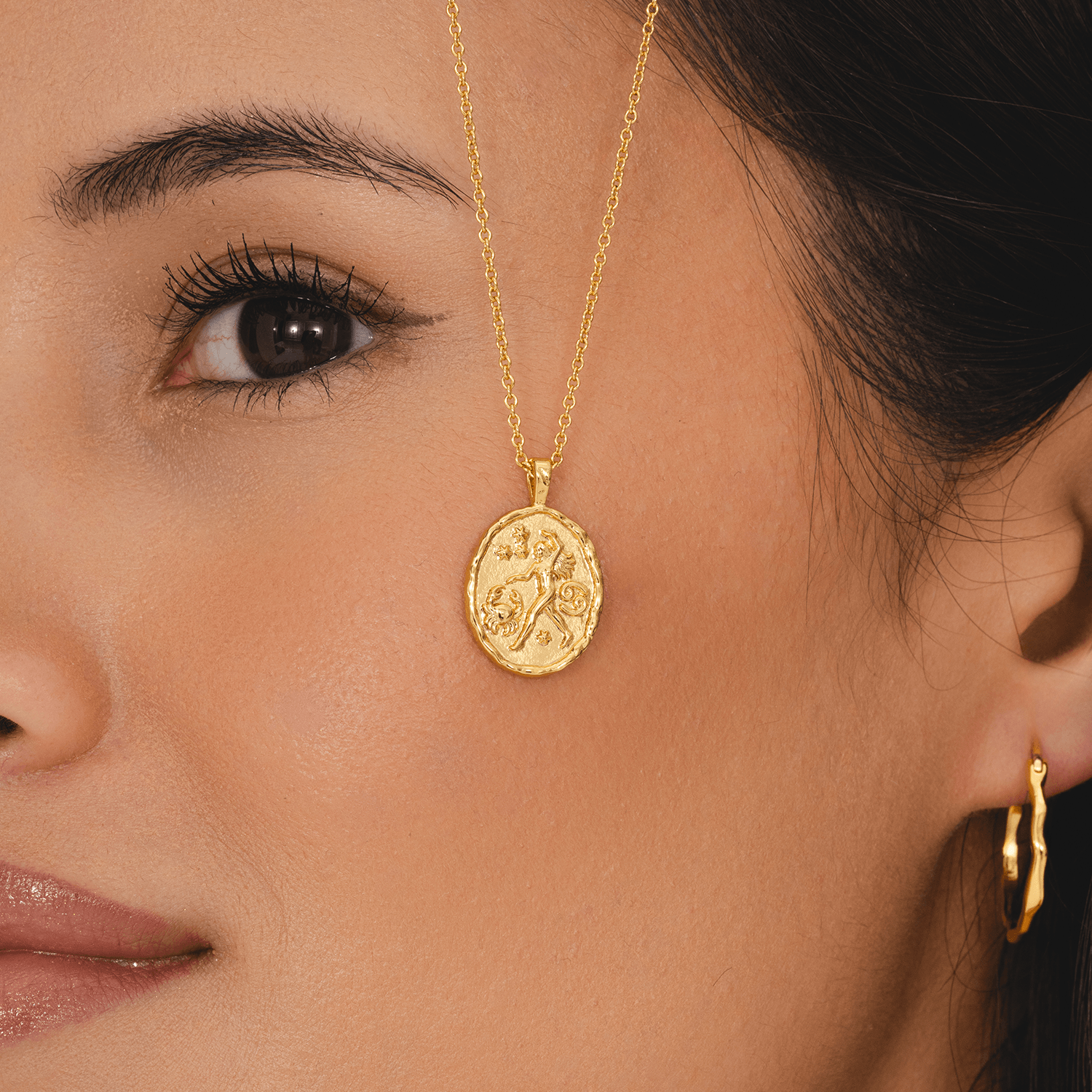 Cancer zodiac coin pendant necklace in gold with crab symbol and constellation stars astrology jewellery