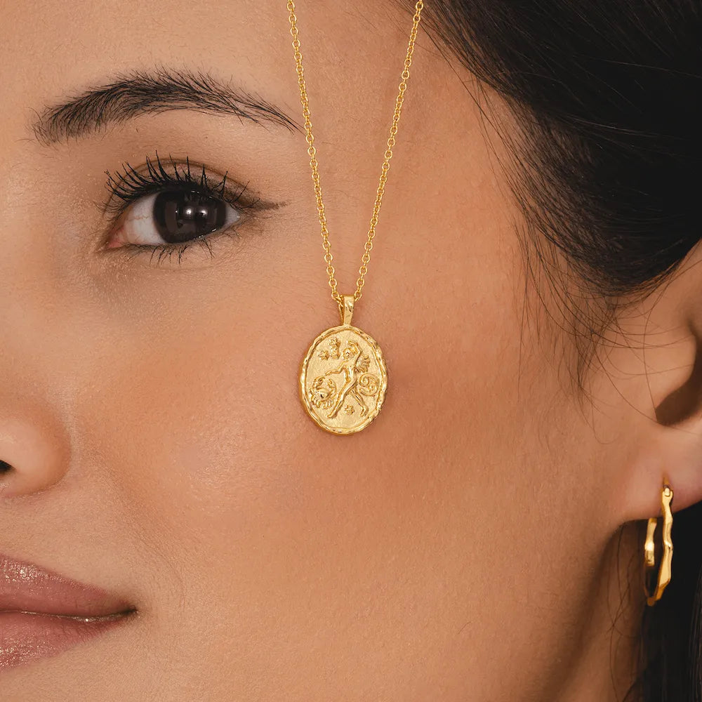 Cancer zodiac coin pendant necklace in gold with crab symbol and constellation stars astrology jewellery