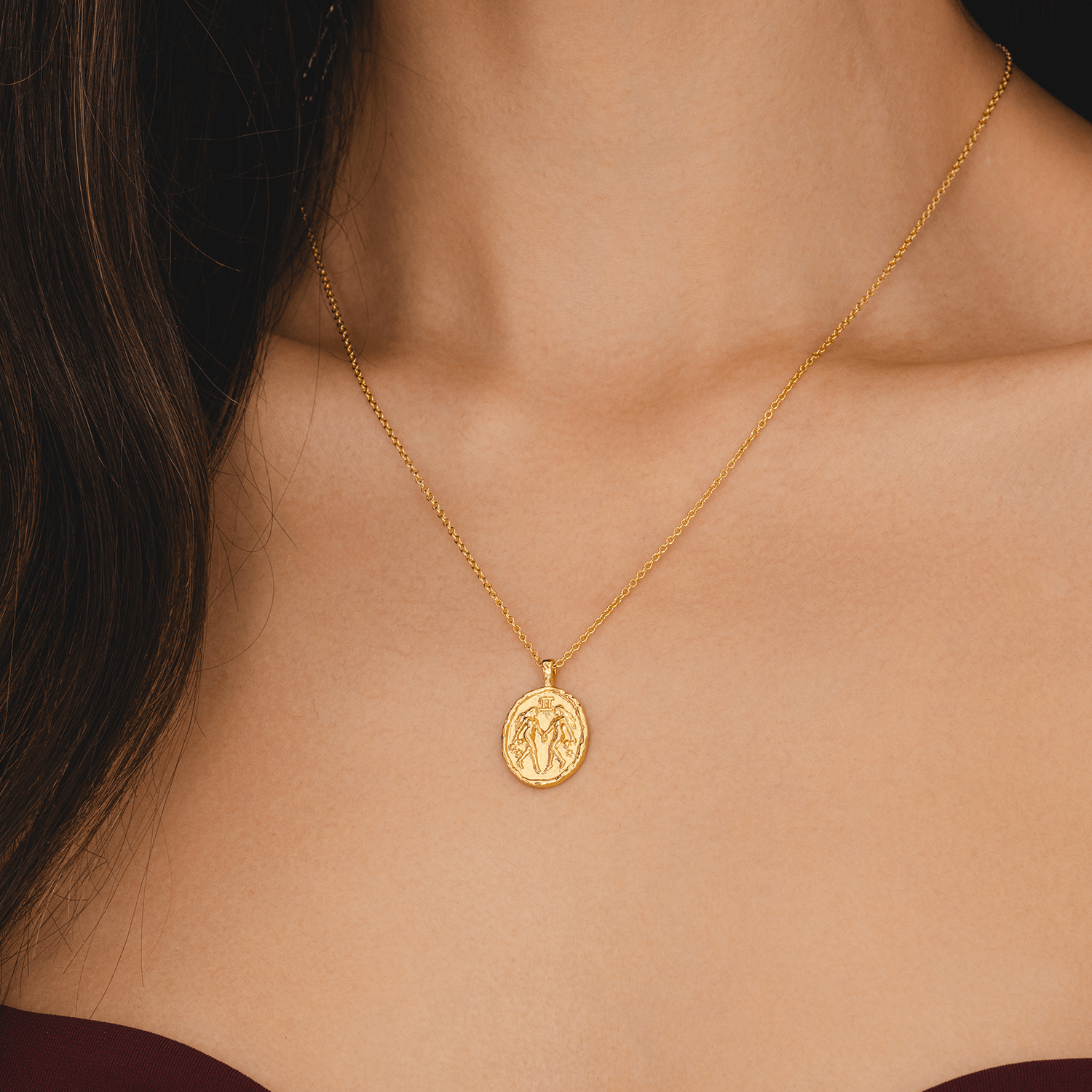 Gemini star sign necklace in gold with twin zodiac symbol and star constellation coin pendant astrology jewellery