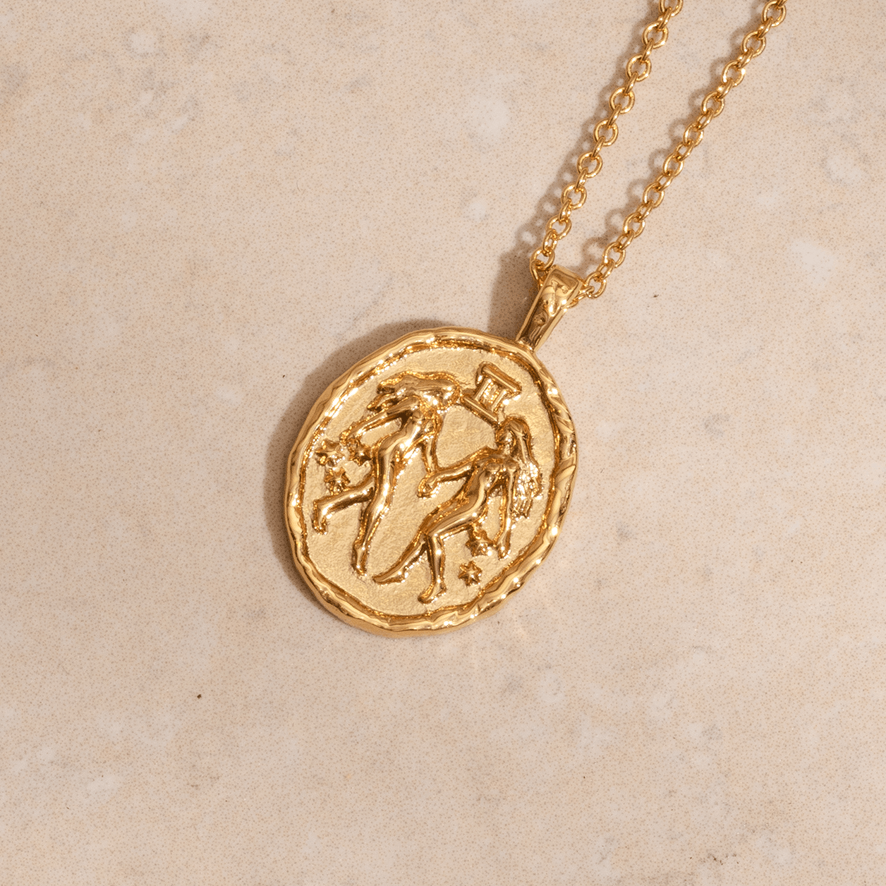 Gemini zodiac necklace in gold with twin symbol and constellation stars on coin pendant astrology jewellery for Gemini star sign