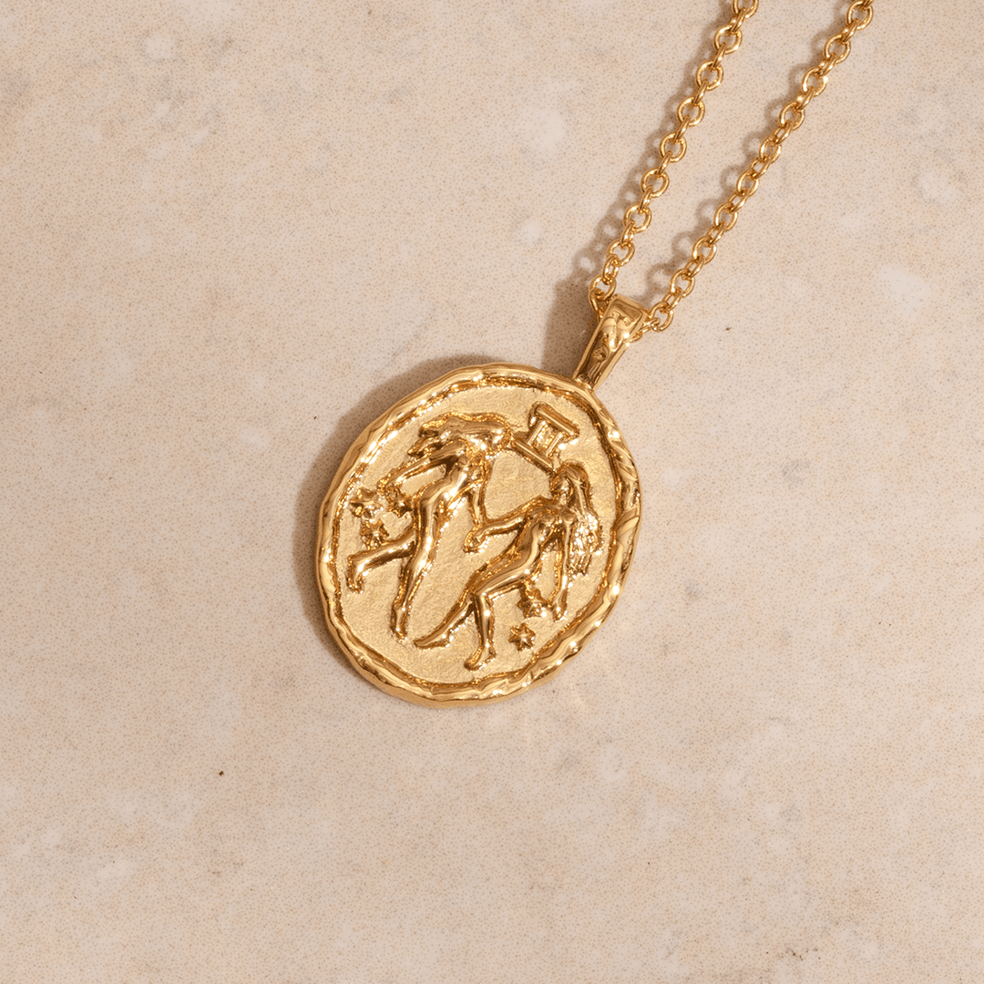 Gemini zodiac necklace in gold with twin symbol and constellation stars on coin pendant astrology jewellery for Gemini star sign