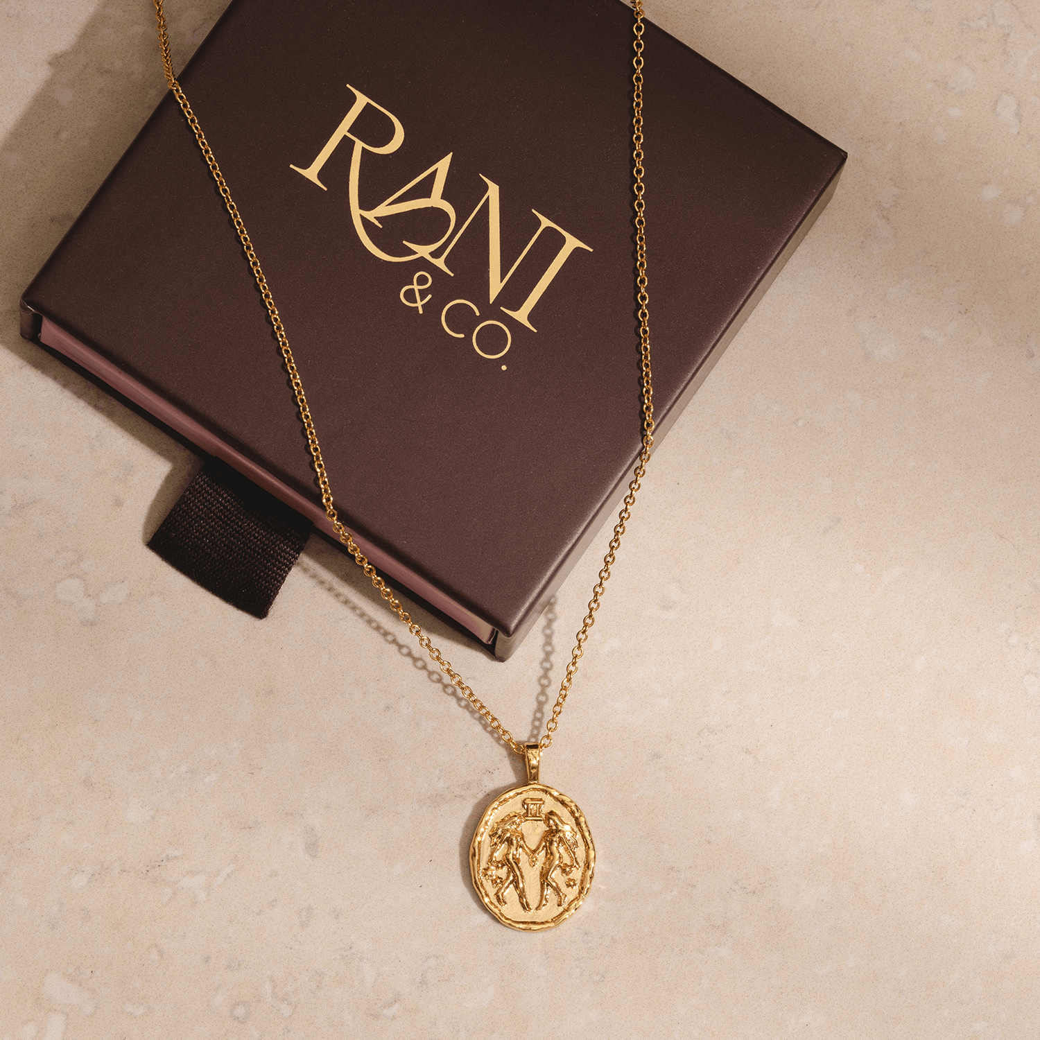 Gold Gemini zodiac pendant necklace with twin symbol and constellation stars astrology jewellery for Gemini sign