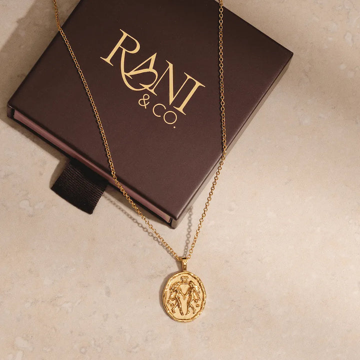 Gold Gemini zodiac pendant necklace with twin symbol and constellation stars astrology jewellery for Gemini sign