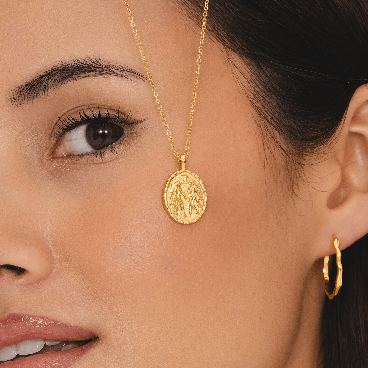Gemini astrology necklace with gold coin pendant featuring twin zodiac symbol and star constellation jewellery