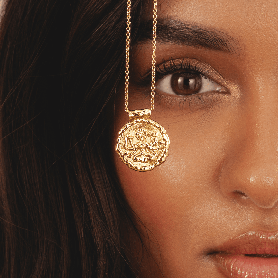 Gold pendant necklace featuring Hindu goddess Durga in 18k plated finish by Rani and Co womens jewellery