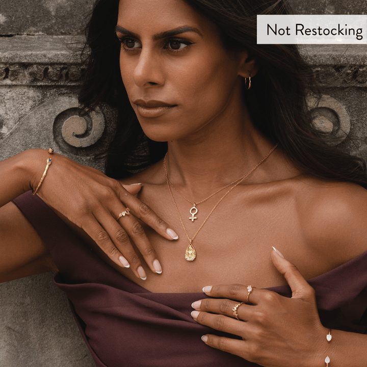 Limited Edition Goddess Lakshmi Rose Quartz Necklace worn with layered gold jewellery for elegant everyday styling.