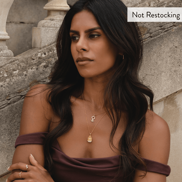 Limited Edition Goddess Lakshmi Rose Quartz Necklace worn with layered gold jewellery and timeless styling.