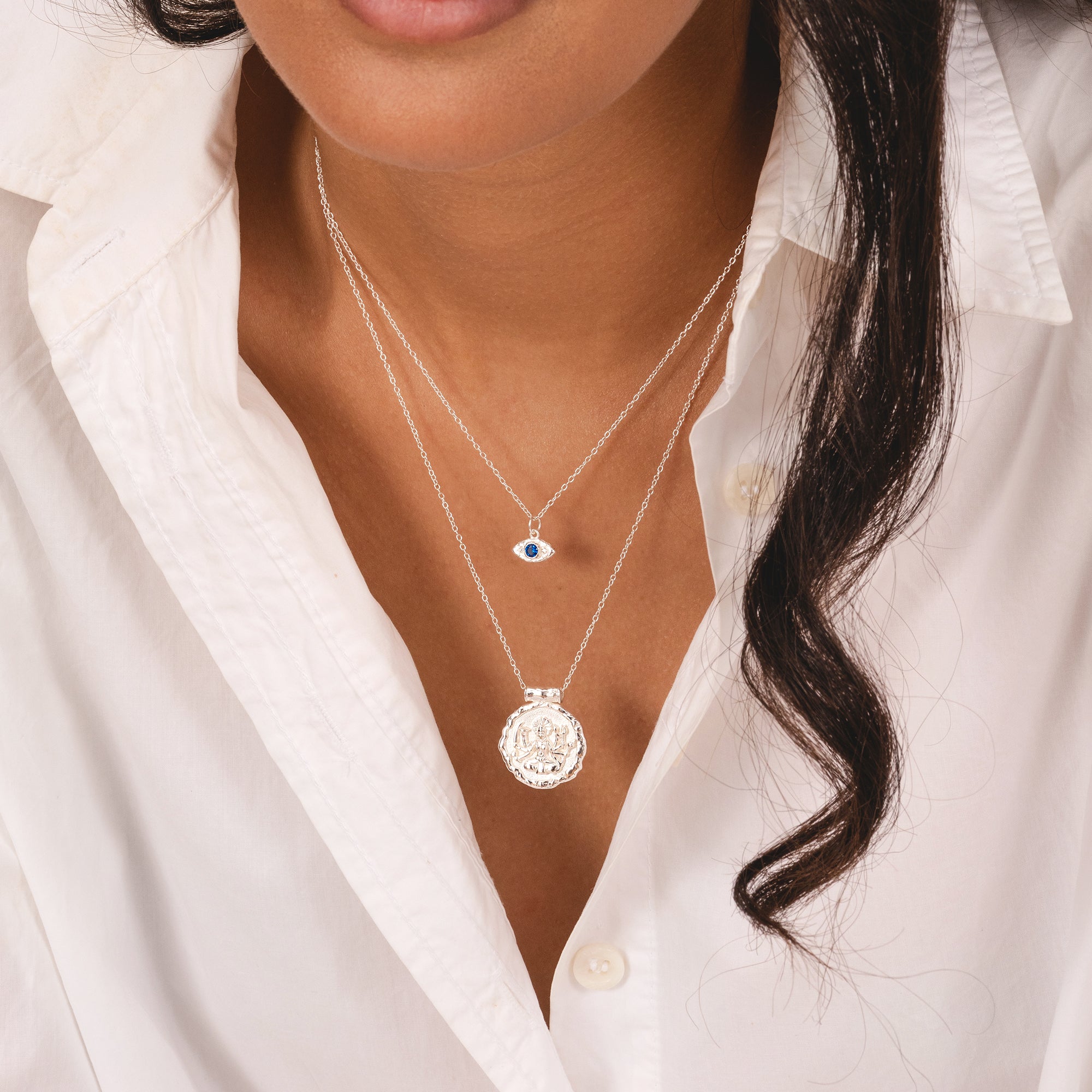 Sterling silver molten evil eye pendant with blue cubic zirconia, Rani & Co.