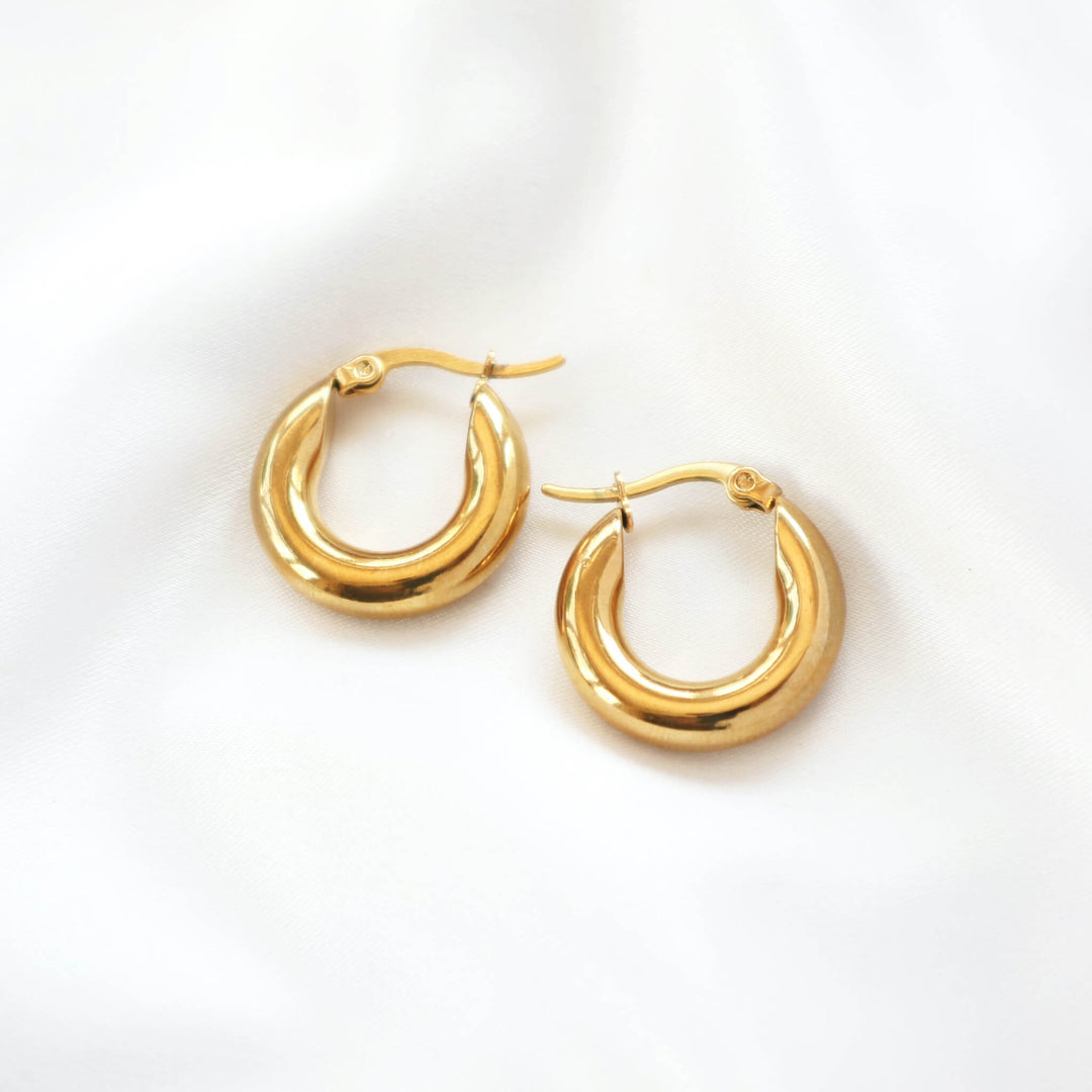 Water resistant gold hoop earrings made from 18k gold plated metal lightweight and stylish womens jewellery by Rani and Co