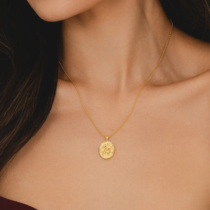 Rani & Co. gold Taurus zodiac pendant necklace, embossed bull symbol and stars 18k plated