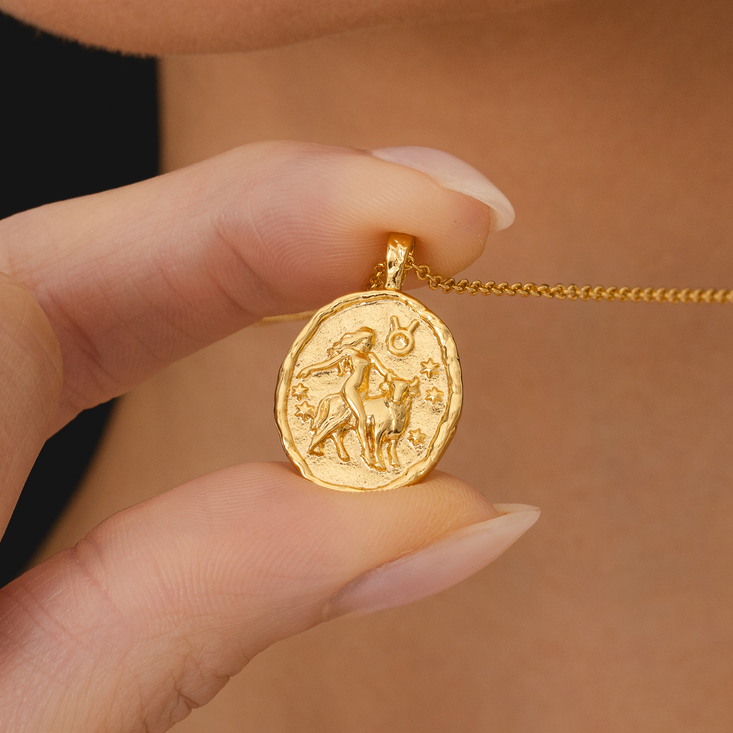 Rani & Co. 18k gold Taurus zodiac medallion pendant, embossed bull and constellation design