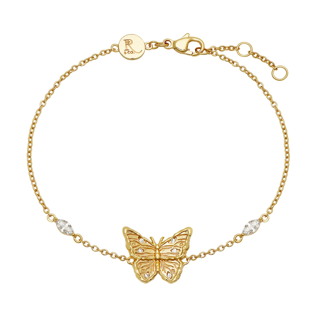 Gold butterfly charm bracelet with marquise cubic zirconia stones, 18k gold-plated recycled brass