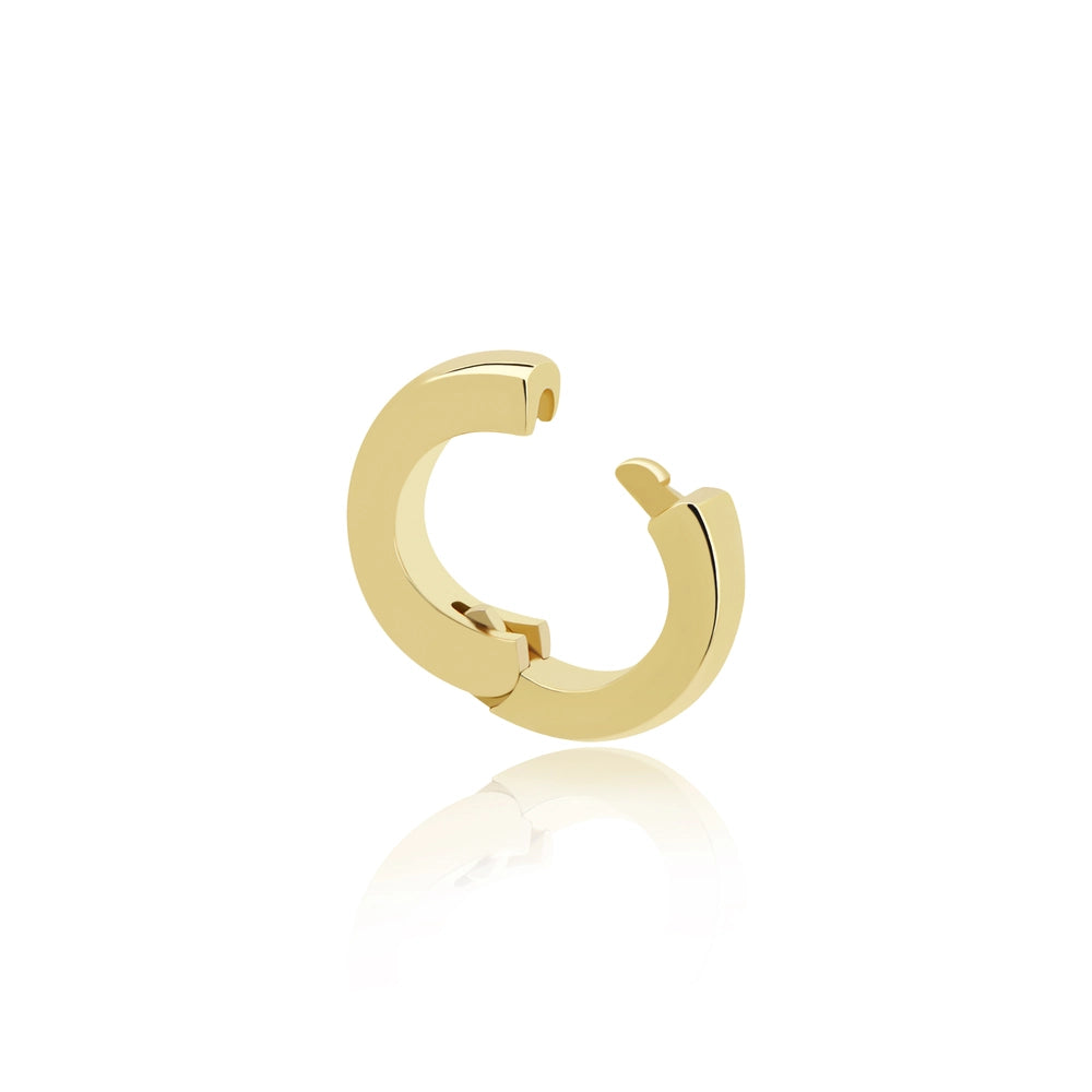 Polished gold hinged charm connector earring hoop on a white background.