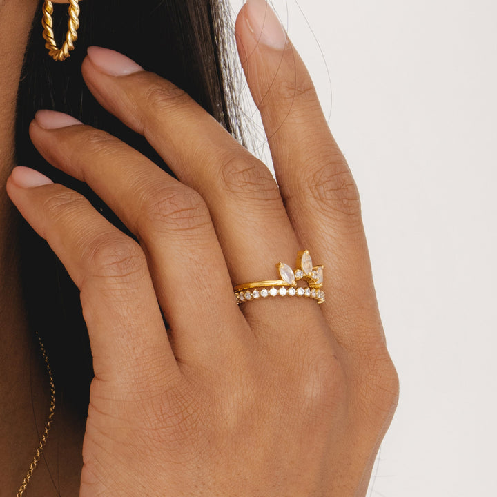 Rainbow moonstone crown ring in gold with three marquise stones.