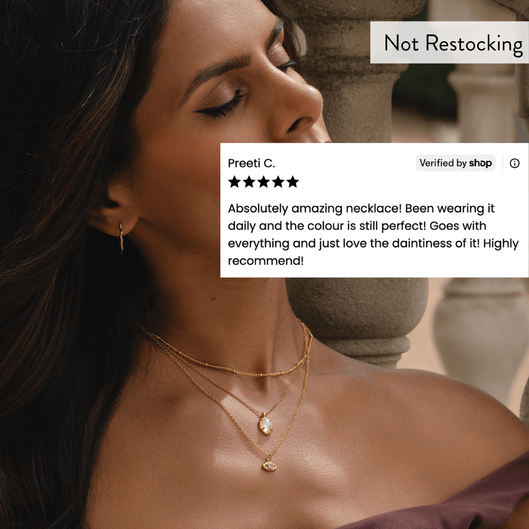 Limited Edition Evil Eye Moonstone Necklace worn layered with 5 star customer review and not restocking message.