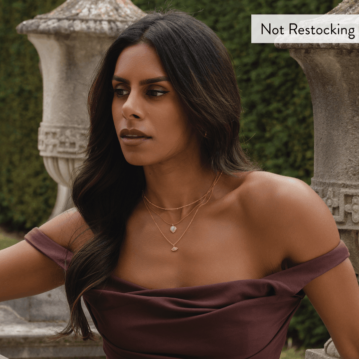 Limited Edition Evil Eye Moonstone Necklace worn with layered gold jewellery for elegant everyday styling.