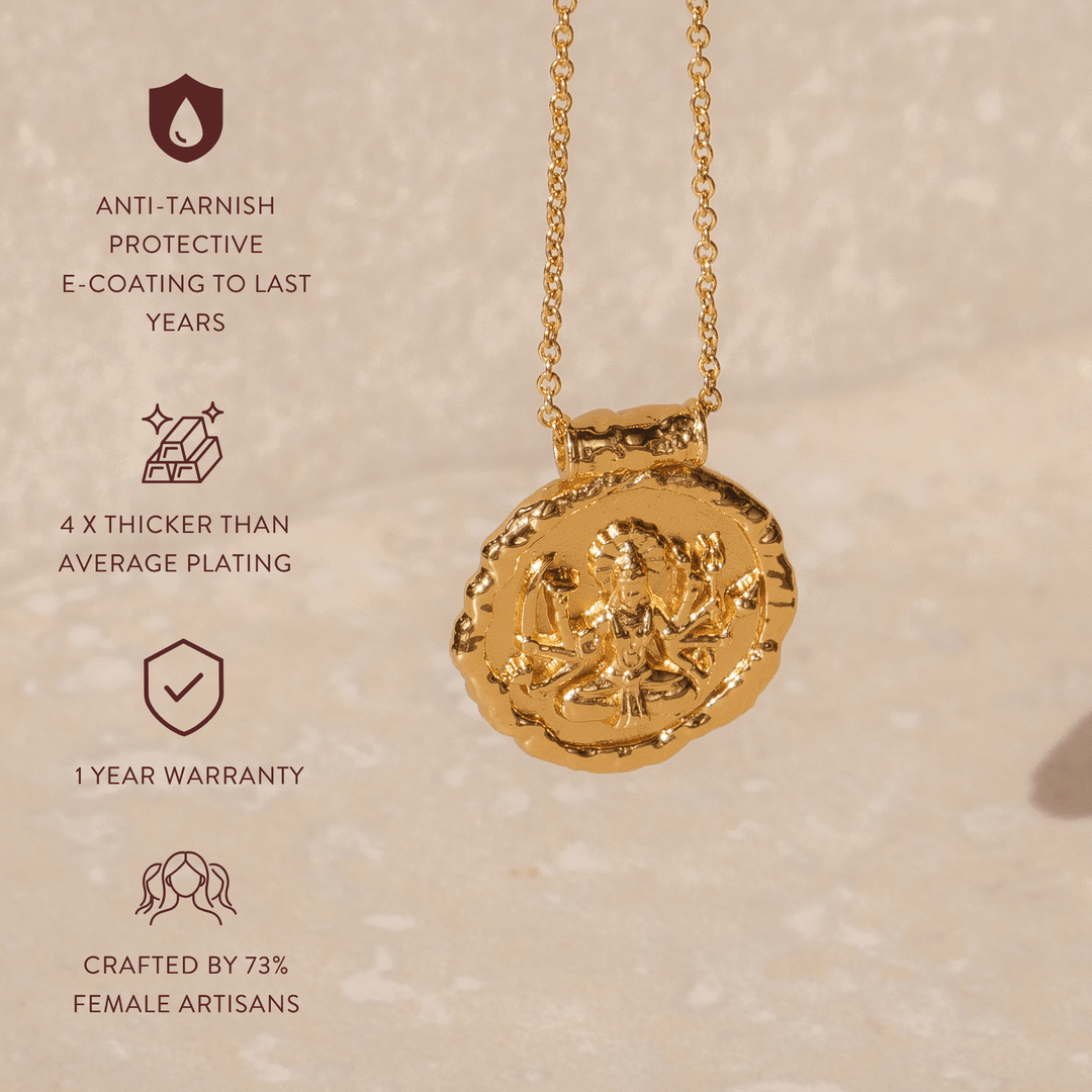 Goddess Durga coin necklace worn on gold chain 