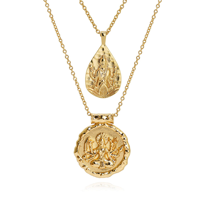 Goddess Durga and Lakshmi necklace set in 18k gold, teardrop and coin pendants layered on white background