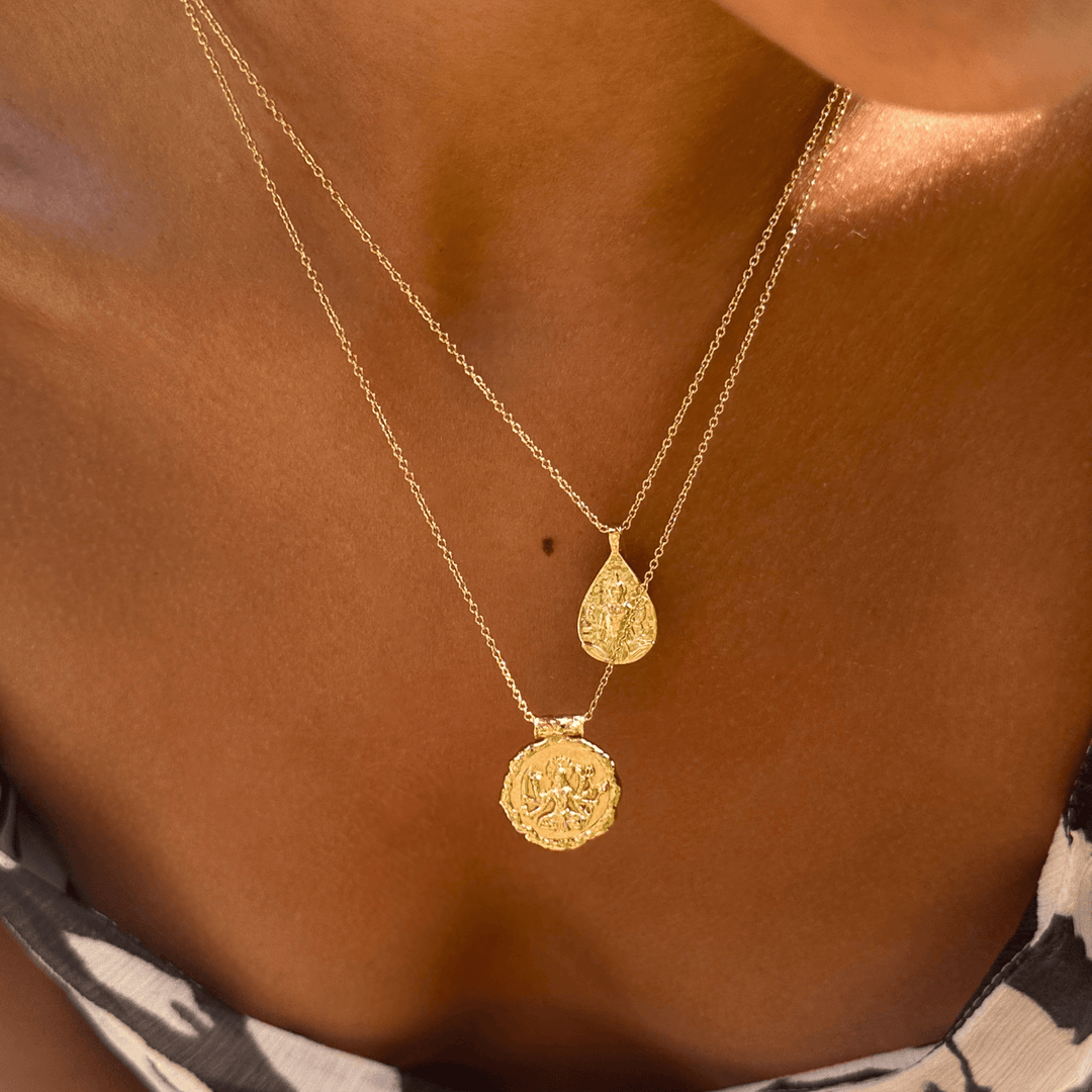 Goddess Durga and Lakshmi necklace set worn layered on skin, with 5-star verified customer review